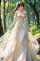 A woman in a wedding dress standing in the woods.