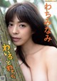 A naked asian woman leaning against a tree in the woods.